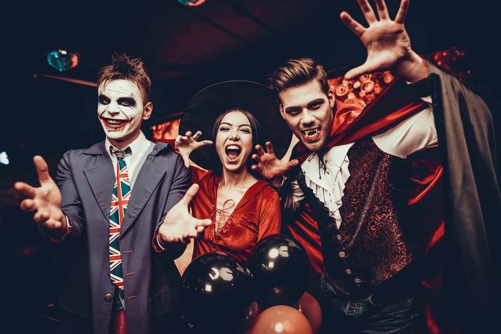 group of people posing in costume for halloween