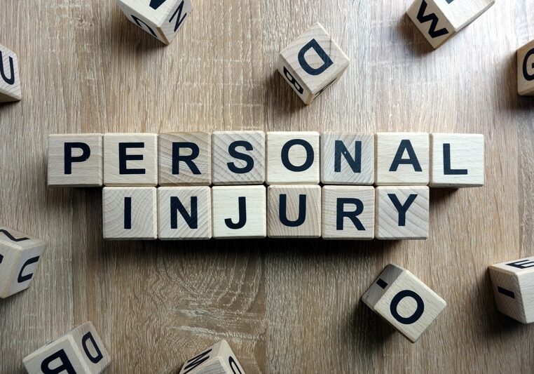 Boston Personal Injury Attorney Blocks Spell Out Personal Injury on a Desk