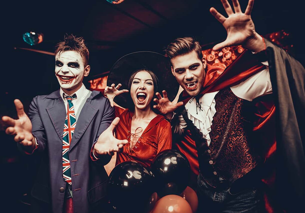 group of people posing in costume for halloween